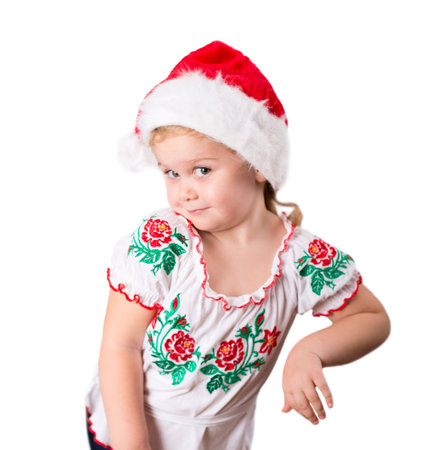 Funny beautiful Little girl whearing Santa's hat isolated on white backgroundの写真素材