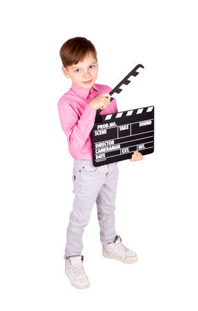Little boy with clapper board isolated on white backgroundの写真素材