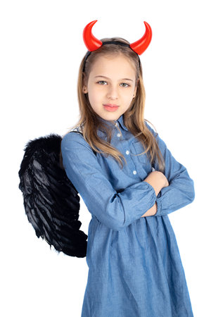 Little girl with a devil costume isolated on white backgroundの写真素材