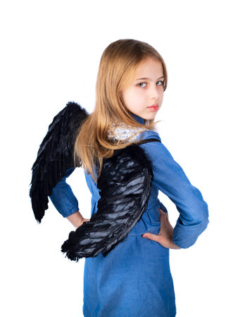 Little girl with a devil costume isolated on white backgroundの写真素材
