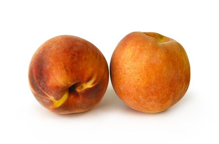 Still life with two peaches on white backgroundの写真素材