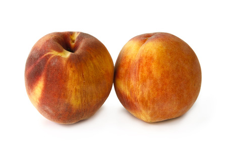 Still life with two peaches on white backgroundの写真素材