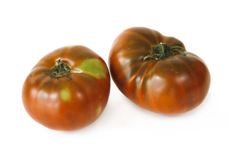 still life with two tomatoes on white backgroundの写真素材
