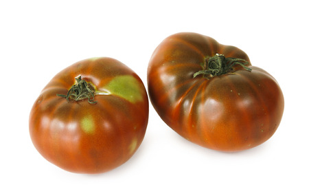 still life with two tomatoes on white backgroundの写真素材