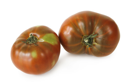 still life with two tomatoes on white backgroundの写真素材