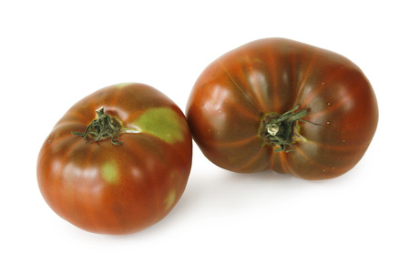 still life with two tomatoes on white backgroundの写真素材