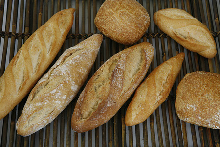 bread baked in a traditional oven and sliced breadの写真素材