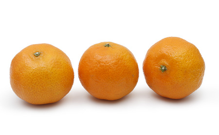 three tangerines on white background. fresh fruitの写真素材