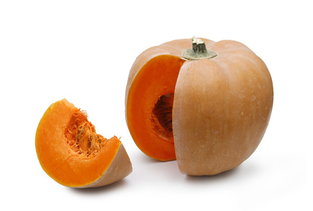 Pumpkin with a slice on white backgroundの写真素材