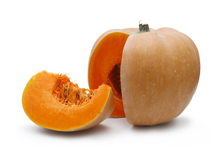 Pumpkin with a slice on white backgroundの写真素材