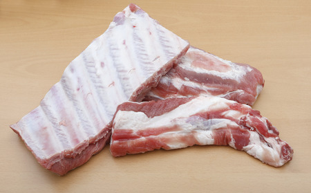 pieces of pork chop on a wooden tableの写真素材
