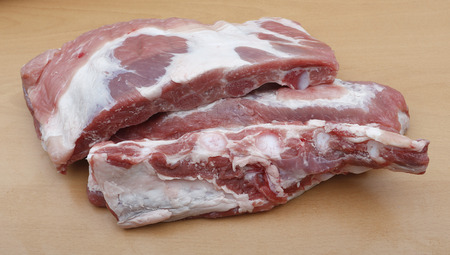 pieces of pork chop on a wooden tableの写真素材