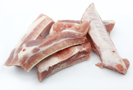 pieces of pork chop on white backgroundの写真素材