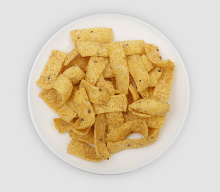 strips of corn on a white plate to peckの写真素材