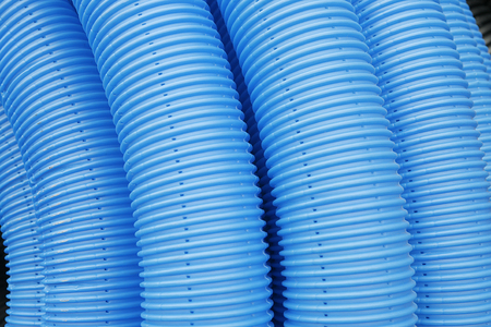 blue corrugated tube for transporting waterの写真素材