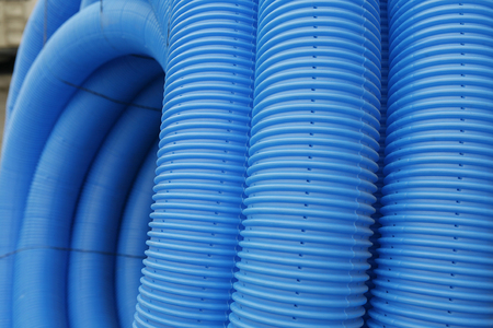 blue corrugated tube for transporting waterの写真素材