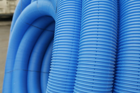 blue corrugated tube for transporting waterの写真素材
