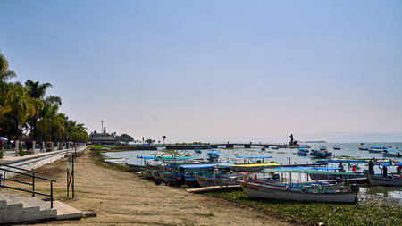 Chapala, Jalisco, Mexico - April 24, 2023: Malecon de Chapala beach with the boats anchored and in...