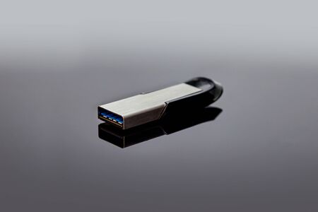 USB flash drive with copy space for sign on gray background.