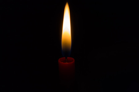 Picture of a red candle in flames