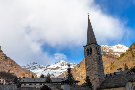 Mountain panorama with peaks, snow, villages, streams and trails near Alagna Valsesia, Italyのeditorial素材