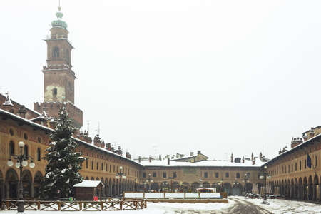 A walk in the historic center of vigevano with views of the Piazza Ducale and the sforzesco castle in Vigevano during a snowfall in 2012のeditorial素材