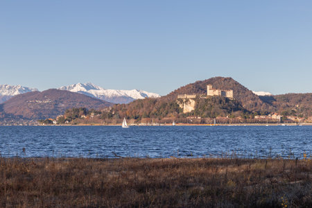 Scenic Lake View With Castle and Snowy Mountains In a Tranquil Settingの写真素材