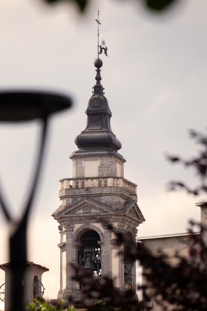 Historic Bell Tower Against a Serene Sky with Architectural Details