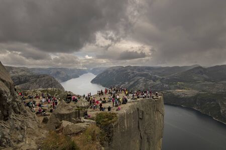 Preikestolen rock over Lysefjord in Norway very crowdedの写真素材