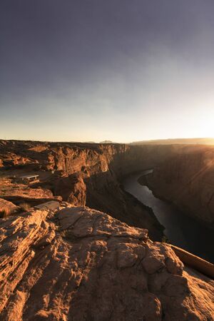 Golden hour view of Colorado river crossing a canyon in Page in Arizona USAの写真素材