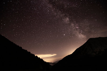Milky way and stars at night in a mountain in Pyrenees in Catalonia