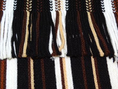 knitted striped fabric with fringeの写真素材