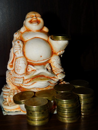 Buddha and coinsの写真素材