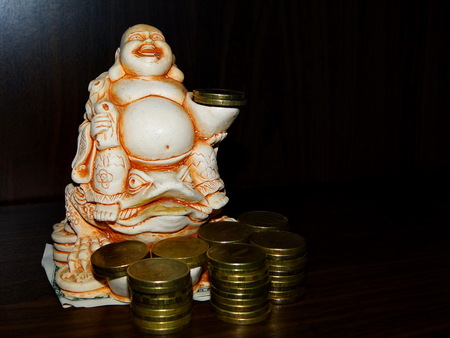 Buddha and coinsの写真素材