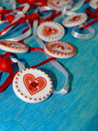 buttons with heart on blue backgroundの写真素材