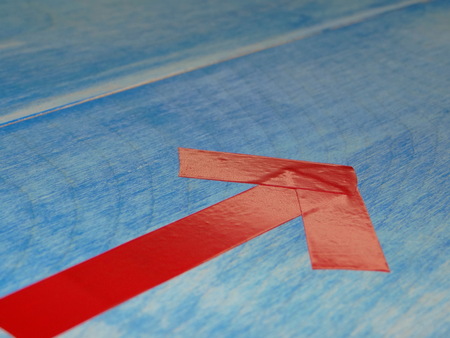 red arrows on blue backgroundの写真素材