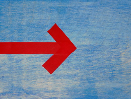 red arrows on blue backgroundの写真素材