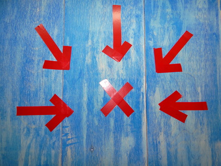 red arrows on blue backgroundの写真素材