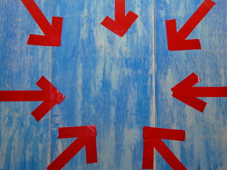 red arrows on blue backgroundの写真素材