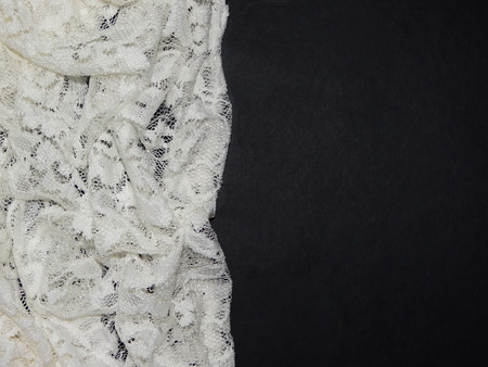 white lace on black backgroundの写真素材