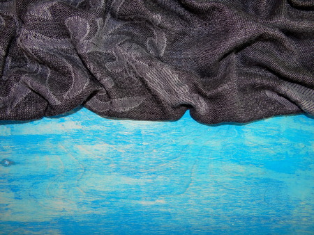 black cloth on the blue wooden boardsの写真素材
