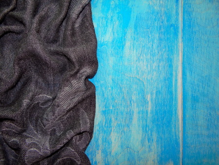 black cloth on the blue wooden boards