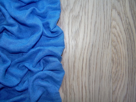 blue cloth over wooden boardsの写真素材