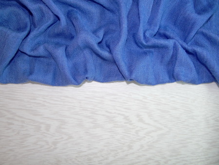 blue fabric on the white wooden boardsの写真素材