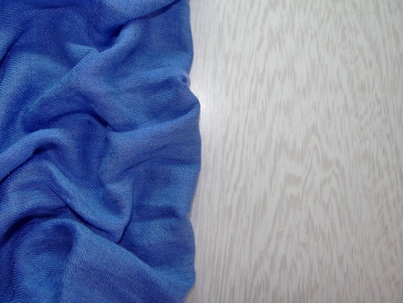 blue fabric on the white wooden boardsの写真素材
