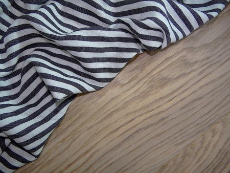 striped fabric on wooden boardsの写真素材
