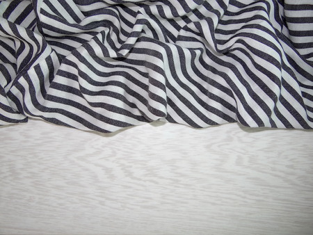 striped fabric on wooden boardsの写真素材