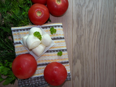 mozzarella with vegetables and greensの写真素材