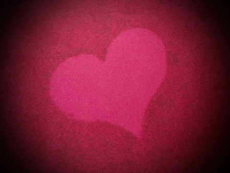 heart on red silkの写真素材