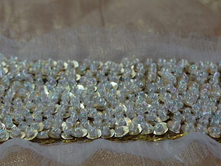 beads on gold fabricの写真素材